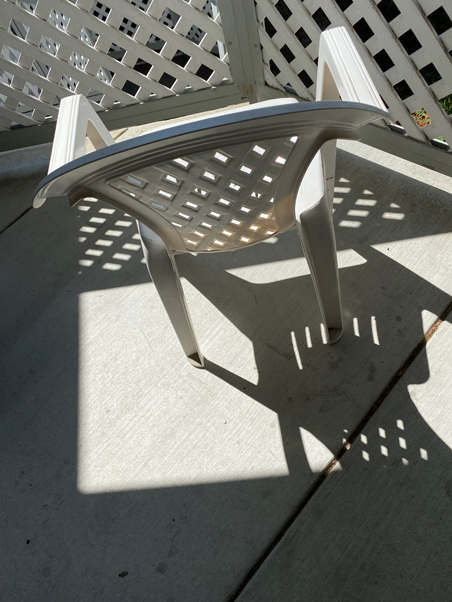 photo of white chair in the sun